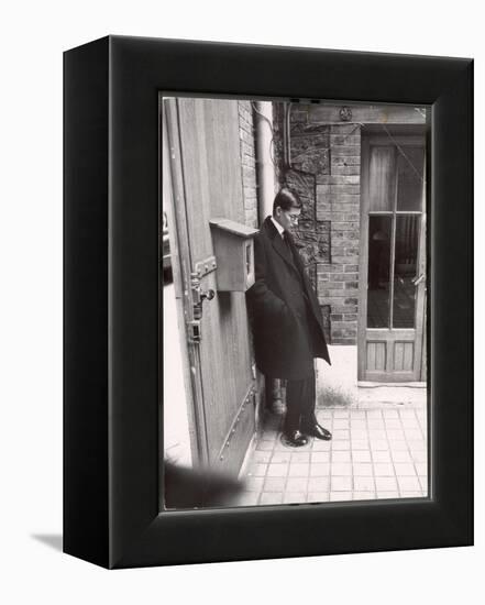 Christian Dior's Successor Yves Saint Laurent Standing Alone After Attending Dior's Funeral-Loomis Dean-Framed Premier Image Canvas