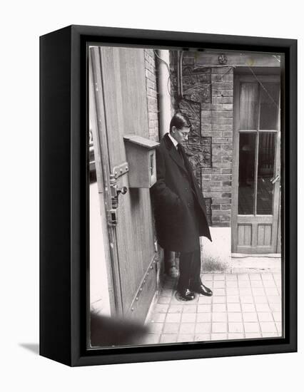 Christian Dior's Successor Yves Saint Laurent Standing Alone After Attending Dior's Funeral-Loomis Dean-Framed Premier Image Canvas