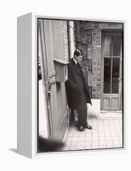 Christian Dior's Successor Yves Saint Laurent Standing Alone After Attending Dior's Funeral-Loomis Dean-Framed Premier Image Canvas