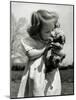 Christina Goldsmith Kissing a Weimaraner Puppy from Her Father's Stock of Weimaraner Hunting Dogs-Bernard Hoffman-Mounted Photographic Print