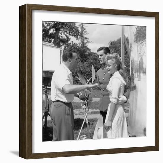 CHRISTINE, 1958 directed by PIERRE GASPARD-HUIT On the set, Pierre Gaspard-Huit directs Alain Delon-null-Framed Photo