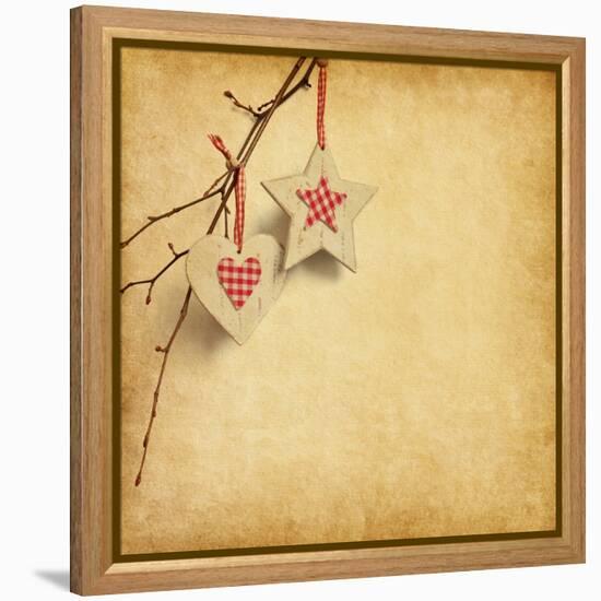 Christmas Decoration Hanging over Old Paper Background-A_nella-Framed Stretched Canvas