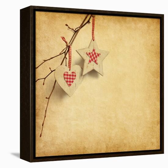 Christmas Decoration Hanging over Old Paper Background-A_nella-Framed Stretched Canvas