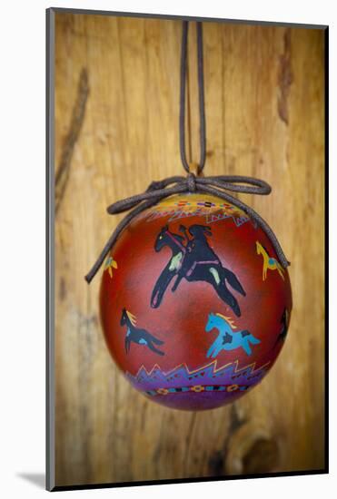 Christmas ornament of a painted ball with colorful Native American horses-Angel Wynn-Mounted Photographic Print