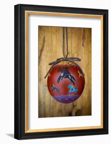 Christmas ornament of a painted ball with colorful Native American horses-Angel Wynn-Framed Photographic Print