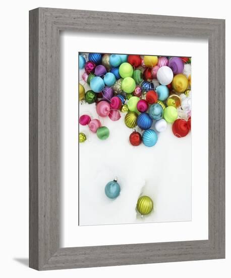 Christmas ornaments on snow-Pauline St. Denis-Framed Photographic Print