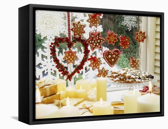 Christmassy Window Decorated with Biscuits and Candles-Linda Burgess-Framed Premier Image Canvas