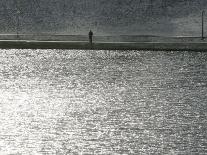 A Man Stands on the Banks of a Small Lake, Munich, on Friday, November 3, 2006.-Christof Stache-Photographic Print