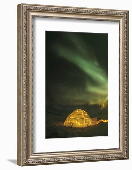 Churchill, Manitoba, Canada. Northern Lights shine above lit igloo.-Yvette Cardozo-Framed Photographic Print