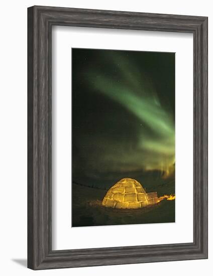 Churchill, Manitoba, Canada. Northern Lights shine above lit igloo.-Yvette Cardozo-Framed Photographic Print