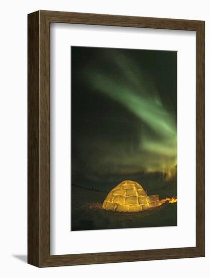 Churchill, Manitoba, Canada. Northern Lights shine above lit igloo.-Yvette Cardozo-Framed Photographic Print