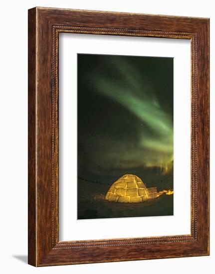 Churchill, Manitoba, Canada. Northern Lights shine above lit igloo.-Yvette Cardozo-Framed Photographic Print