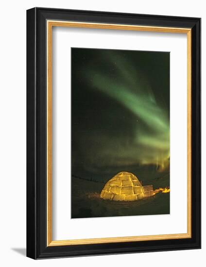 Churchill, Manitoba, Canada. Northern Lights shine above lit igloo.-Yvette Cardozo-Framed Photographic Print