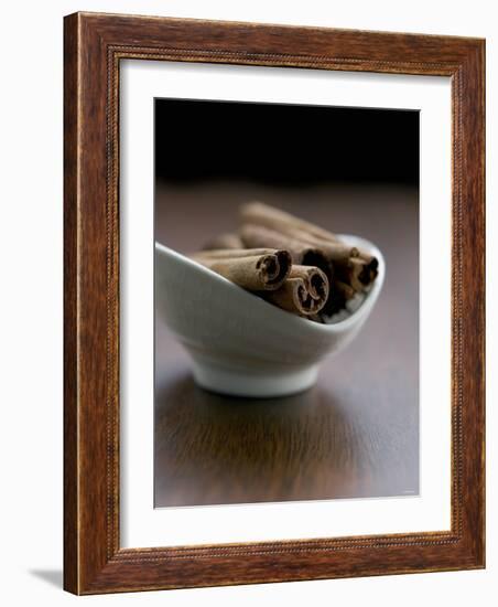 Cinnamon Sticks in Small Bowl-Henrik Freek-Framed Photographic Print