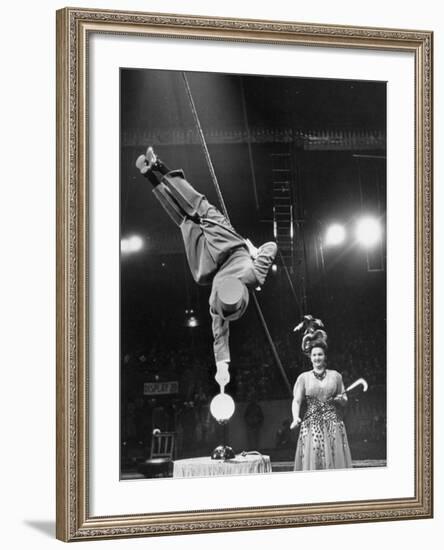 Circus Performer Balancer Unus Standing on His Index Finger on Globe Feet in Air Back of Head-Ralph Morse-Framed Photographic Print
