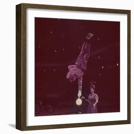 Circus Performer Balancing on Forefinger-Ralph Morse-Framed Photographic Print