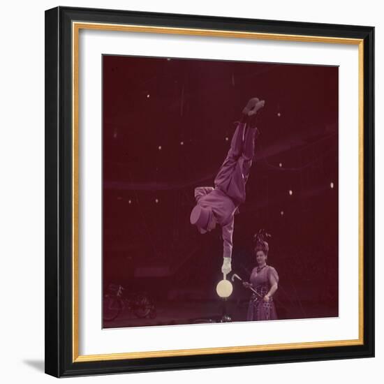 Circus Performer Balancing on Forefinger-Ralph Morse-Framed Photographic Print