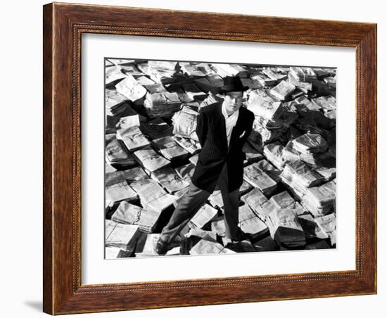 Citizen Kane, Orson Welles, 1941, Astride Stacks Of Newspaper-null-Framed Photo