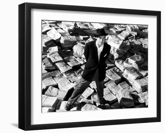 Citizen Kane, Orson Welles, 1941, Astride Stacks Of Newspaper-null-Framed Photo