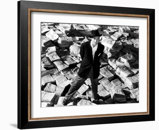 Citizen Kane, Orson Welles, 1941, Astride Stacks Of Newspaper-null-Framed Photo