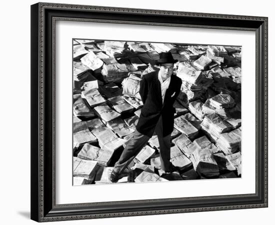 Citizen Kane, Orson Welles, 1941, Astride Stacks Of Newspaper-null-Framed Photo