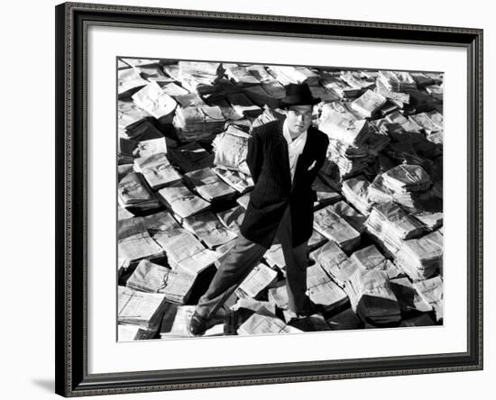 Citizen Kane, Orson Welles, 1941, Astride Stacks Of Newspaper-null-Framed Photo