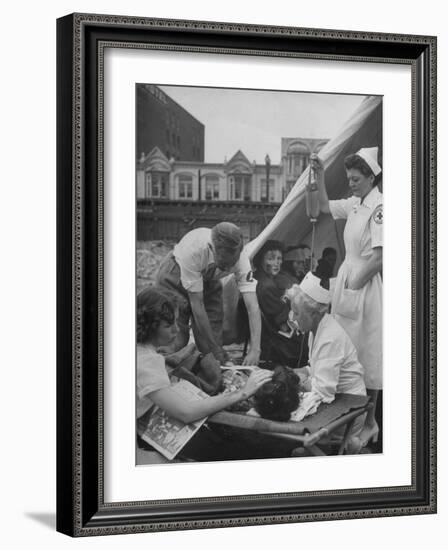 Civilian Receiving a Blood Transfusion from the British Red Cross Setup in a Tent-Allan Grant-Framed Photographic Print