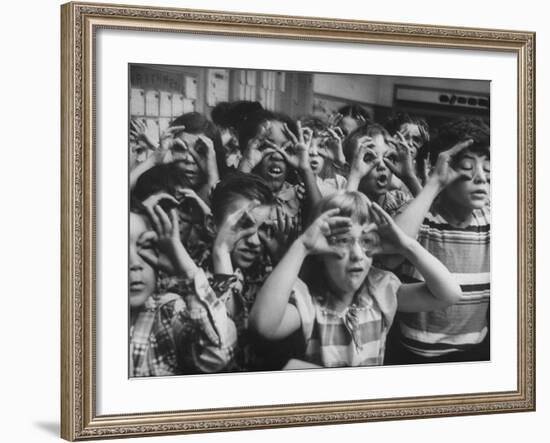 Classroom Full of Students Circling Fingers Around Eyes in Form of Glasses During Music Class-Francis Miller-Framed Photographic Print