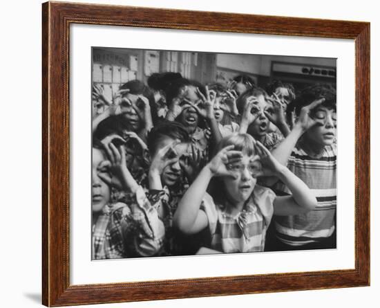 Classroom Full of Students Circling Fingers Around Eyes in Form of Glasses During Music Class-Francis Miller-Framed Photographic Print