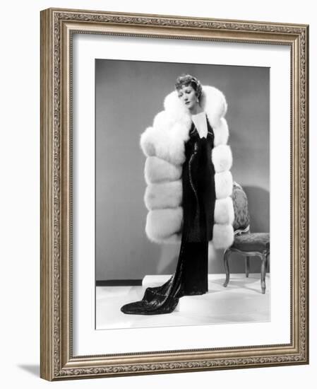 Claudette Colbert, in Travis Banton Gown and White Fox Fur Coat, c.1935-null-Framed Photo