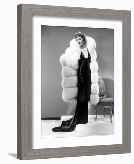 Claudette Colbert, in Travis Banton Gown and White Fox Fur Coat, c.1935-null-Framed Photo