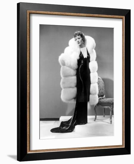 Claudette Colbert, in Travis Banton Gown and White Fox Fur Coat, c.1935-null-Framed Photo