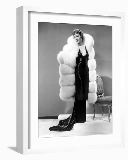 Claudette Colbert, in Travis Banton Gown and White Fox Fur Coat, c.1935-null-Framed Photo