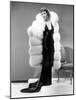 Claudette Colbert, in Travis Banton Gown and White Fox Fur Coat, c.1935-null-Mounted Photo