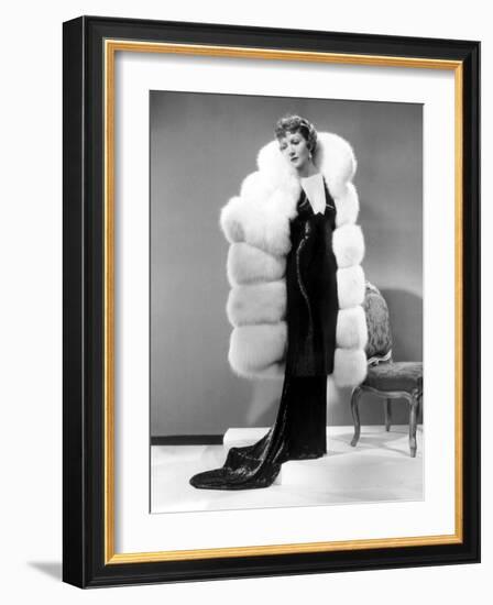 Claudette Colbert, in Travis Banton Gown and White Fox Fur Coat, c.1935-null-Framed Photo