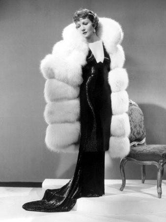 Claudette Colbert, in Travis Banton Gown and White Fox Fur Coat, c.1935'  Photo | Art.com
