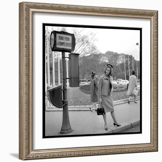 Claudia Cardinale Waiting Near the Champs-Elysées Roundabout, April 1964-Marcel Begoin-Framed Photographic Print