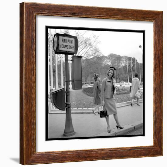 Claudia Cardinale Waiting Near the Champs-Elysées Roundabout, April 1964-Marcel Begoin-Framed Photographic Print