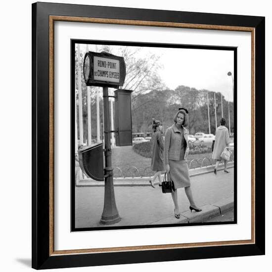 Claudia Cardinale Waiting Near the Champs-Elysées Roundabout, April 1964-Marcel Begoin-Framed Photographic Print