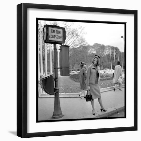 Claudia Cardinale Waiting Near the Champs-Elysées Roundabout, April 1964-Marcel Begoin-Framed Photographic Print