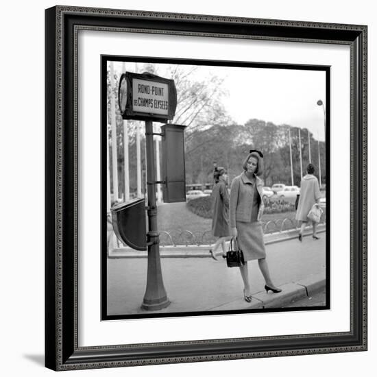 Claudia Cardinale Waiting Near the Champs-Elysées Roundabout, April 1964-Marcel Begoin-Framed Photographic Print