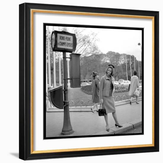 Claudia Cardinale Waiting Near the Champs-Elysées Roundabout, April 1964-Marcel Begoin-Framed Photographic Print