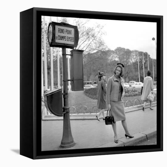 Claudia Cardinale Waiting Near the Champs-Elysées Roundabout, April 1964-Marcel Begoin-Framed Premier Image Canvas