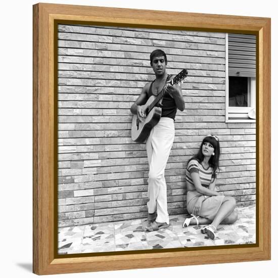 Claudia Mori Looking at Adriano Celentano Playing the Guitar-Marisa Rastellini-Framed Premier Image Canvas