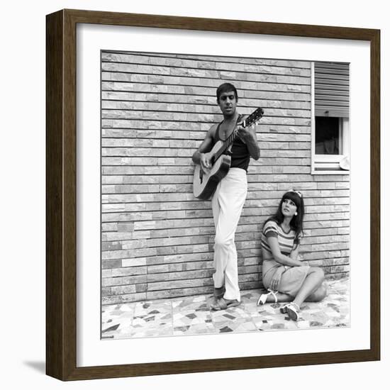 Claudia Mori Looking at Adriano Celentano Playing the Guitar-Marisa Rastellini-Framed Photographic Print