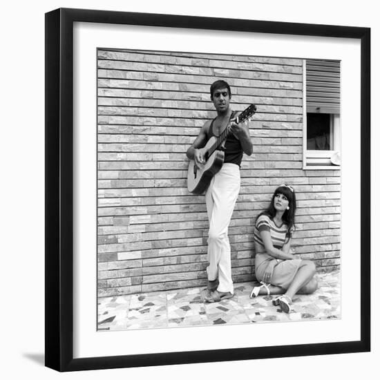 Claudia Mori Looking at Adriano Celentano Playing the Guitar-Marisa Rastellini-Framed Photographic Print