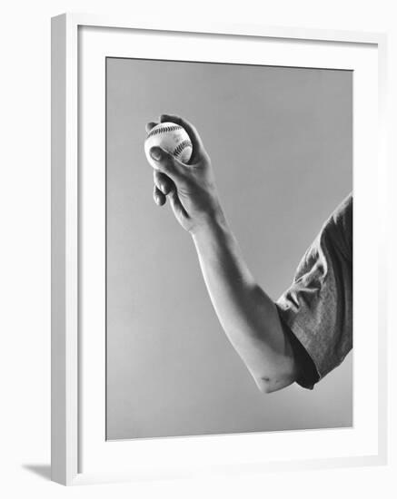 Cleveland Indians Pitcher Bob Feller Demonstrating How He Holds Ball, Beginning of Fast Ball Pitch-Gjon Mili-Framed Premium Photographic Print