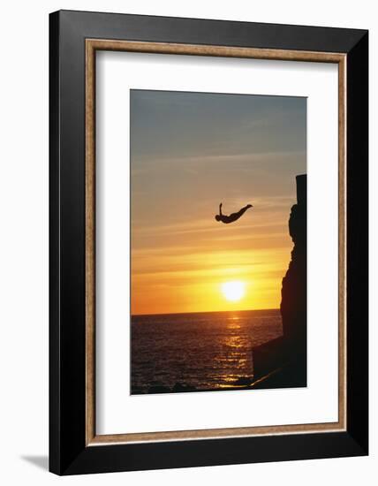 Cliff Diver above Setting Sun-Bob Krist-Framed Photographic Print