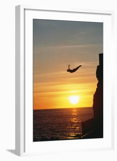 Cliff Diver above Setting Sun-Bob Krist-Framed Photographic Print