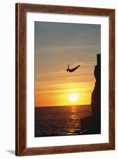 Cliff Diver above Setting Sun-Bob Krist-Framed Photographic Print